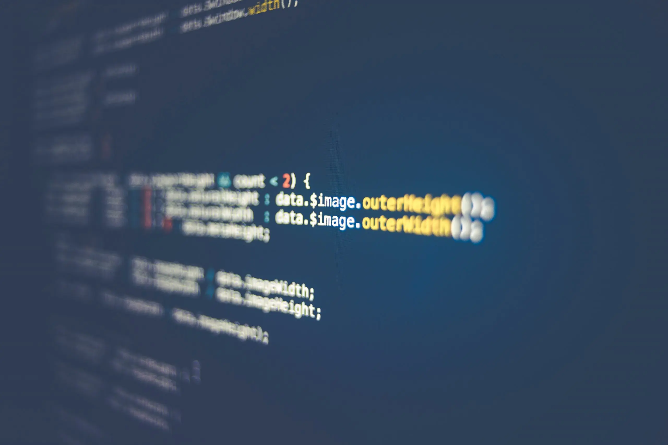 Reviewing software code on a laptop